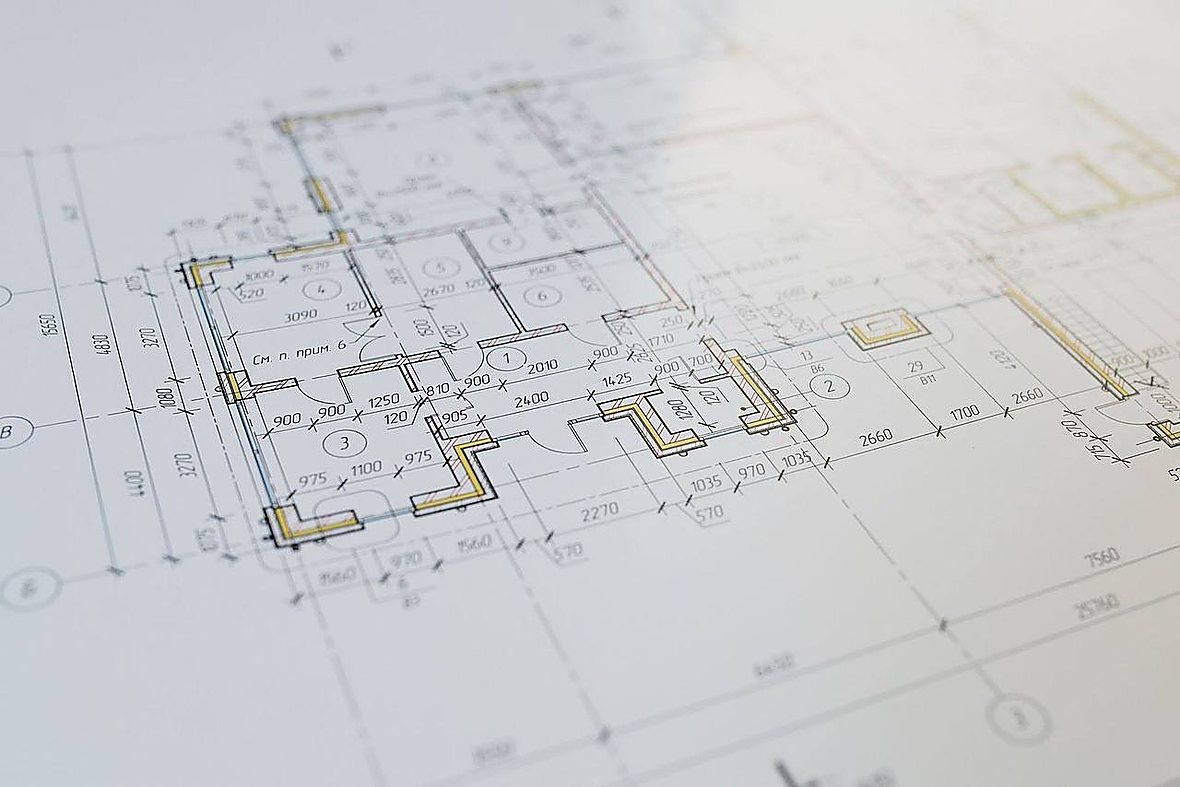Construction blueprint and project plan on site